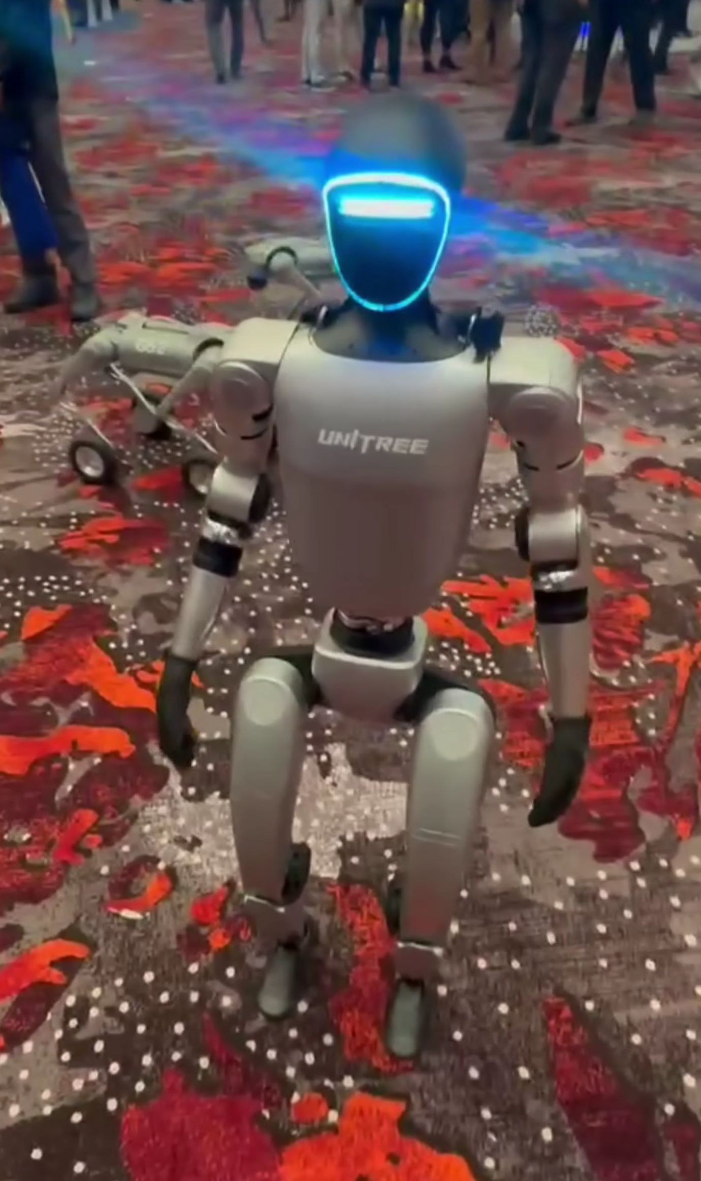 A Unitree G1 humanoid robot on display